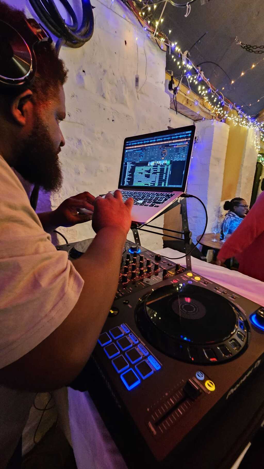 Close-up of DJ controller and laptop
